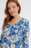 Blouse col rond avec accessoire perle