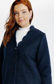 Manteau long en matière bouclette