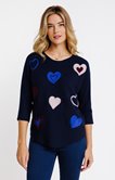 Pull avec coeurs brodés