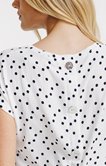 Tee-shirt à pois boutons au dos
