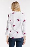 Chemise unie et broderie fleurs
