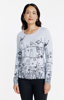 Pull imprimé chats dans un jardin