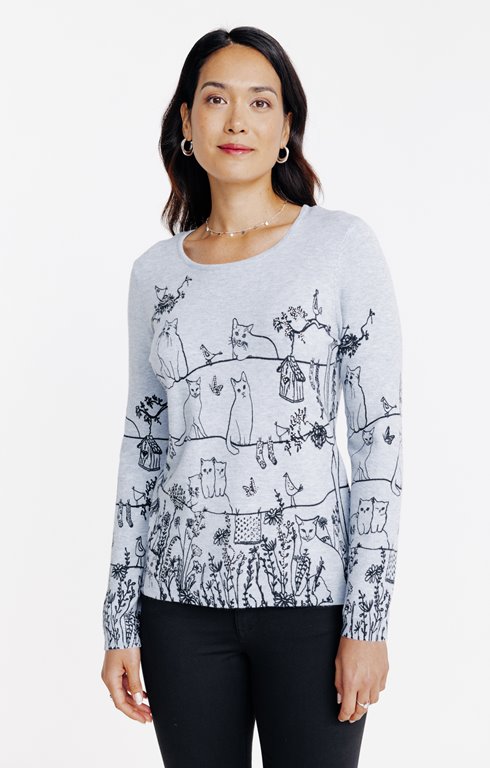 Pull imprimé chats dans un jardin